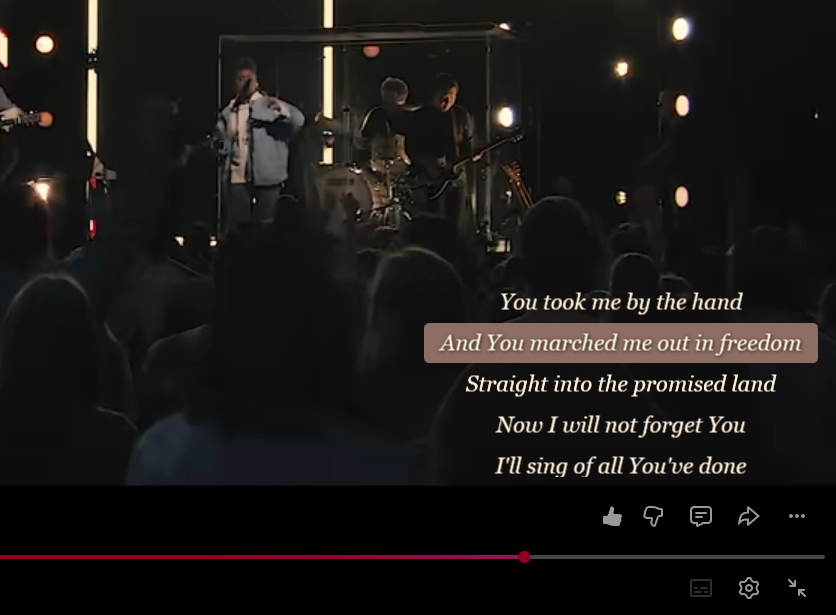 Synced lyrics overlaid on a YouTube music video, with the current line highlighted